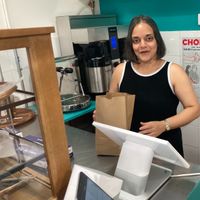 Gigi herself at the counter. at Gigi's Doughnuts in New York City
