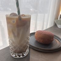 Oat iced latte and jam doughnut   at Corner  in South East London