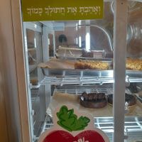 "Love Thy Cat" stiker at Meshigane in Zikhron Yaakov