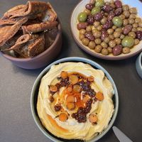Marinated olive, hummus, and crispy pita are all vegan    at Meli Wine & Mezze in Washington