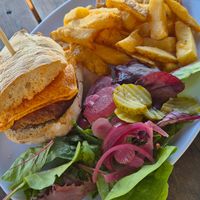 Green mountain burger and vegan cheese and sauce at The Three Pilchards  in Polperro