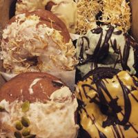 An assortment of their delicious donuts ^_^ Be warned: they are extremely filling (and obviously extremely tasty!!!), but they don't last too long. So if you're getting a good sized box like this, be sure you have a good crowd to share them with. at Through Being Cool Vegan Baking Co. in Toronto