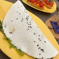 Tapioka crêpe with avocado, tomatoes, salad and balsamic glazee  at Yellow Bourbon in Faro