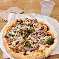 Thick crust pizza with vegan cheese, vegan sausage, and various veggies at Mod Pizza - Midtown in Phoenix