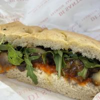 Sandwich vegano: roasted aubergine, san marzano tomato sauce, caramellized onions, rocket  at Disanto in Corfu