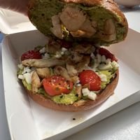Vegan chicken, avocado, tomato and vegan cheese in a huge seeded bagel   at California Bakery - Corso Garibaldi in Milan