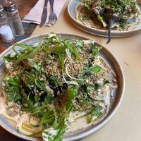 Melanzane al forno con taina, semi ed erbe at Les Grands Vilains in Granville