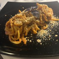 Tonnarello di pesto rosso con mandorle, melanzane e baslico fresco  at La Voglia in Malcesine