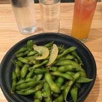 Edamame starter with "RX" natural refreshment (orange, pineapple, coconut water, Kombucha) at Mill Valley Kitchen in Rochester