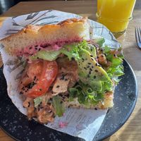 Focaccia filled with beetroot hummus, lettuce, tomato and avocado   at Pella's Cafe & Bakery in Tampere
