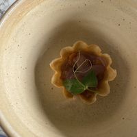 Amuse bouche : tartelette pêche avec échalote   at Auberge Des Aryelets in Aulon