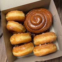 Glazed donuts, cinnamon roll on top of an apple fritter at Ronald's Donuts in Las Vegas