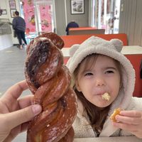 Size of cinnamon twist compared to small vegan child’s head lol  at Ronald's Donuts in Las Vegas