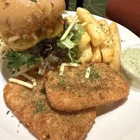 Burger with hash brown patties and yucca friess  at A Lo Vegano Orlando in Orlando