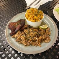 pork, fried plantains, mac at A Lo Vegano Orlando in Orlando