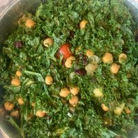 Kale & Cucumber Salad - Kale, fresh cucumbers, chickpeas, chopped red onions, grape tomatoes and dried cranberries with vegan mint & cilantro dressing at India Restaurant in Providence