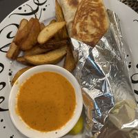 Vegan wrap with potato wedges   at Habibi's Mediterranean in Guam
