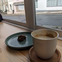 Latte and cookie which we ate before photographing!  at Tempt in Totnes