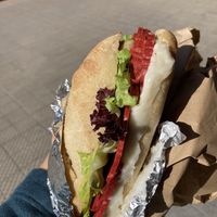 Salami with melted mozzarella and artichokes  at Machete Carnicería Vegana - Providencia in Santiago