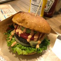 Veggie burger loaded with toppings! at CHOICE in Kyoto