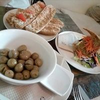 Bread with tomatoes, olives, and Love sandwich at El Cafe Blueproject in Barcelona