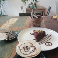 Coconut sugar chocolate cake and cereal caffeine free coffee at El Cafe Blueproject in Barcelona