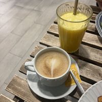 Oat latte and orange juice  at Amaria Café in Costa Da Caparica
