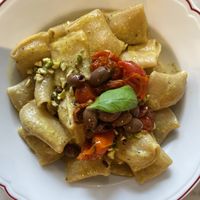 Paccheri con crema di pistacchi, granella di pistacchi, olive taggiasche e pomodorini   at Mi Scusi in Bergamo