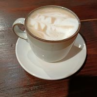 Oat flat white (comes with a Biscoff!) at The Soak Bar & Grill in Birmingham