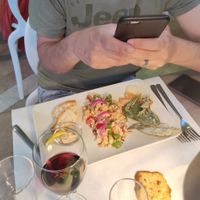 Antipasto con hummus di legumi, cous cous estivo, mix verdure pastellate. at PeR Magnà in Frattuccia