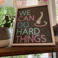 The shop has lots of light, plants, and bright colors 😊  at Vertex Coffee Roasters in Ann Arbor