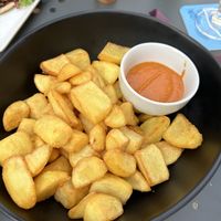 Patas bravas con salsa piccante al pomodoro   at 360 Bistrot in Castell Arquato