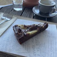 Pear chocolate cake and coffee with oat milkk  at Hotel Pokljuka in Zgornje Gorje