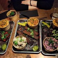 Bar a couple of sides this is "one of everything". Smoked Tofu, Brisket, Ribs, mini mac, coleslaw, potato salad, and burnt ends in the top left. at Saint Monday in East London