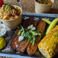 Smoked brisket in bourbon BBQ sauce , smoked corn, and mac and cheese at Saint Monday in East London