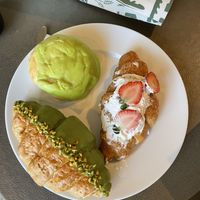 Strawberry cream croissant, pistachio croissant, pistachio pineapple bun  at Maya x The Cakery  in Hong Kong Island