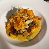 Confit carrot korma, coriander yoghurt, crispy bhaji, pickled kohlrabi  at The Royal  in Wallingford
