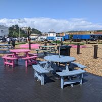 Seating by the crazy golf at Hulas Beach Shack in Folkestone