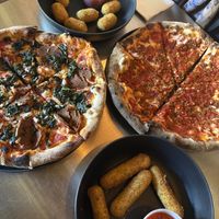 Florentine on the left, jalapeño poppers, Fra Diavolo, and the mozzarella sticks   at DeFazio's Pizzeria in Albany