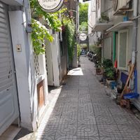 Walking back down the alley at Chạm Vegetarian & Coffee in Ho Chi Minh City