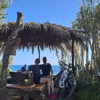 Beautiful table spots between tall grass at Safari Bar in Premantura