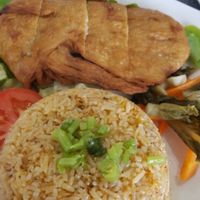 Crispy soy chicken with tomato rice at World Vegan in Cabramatta