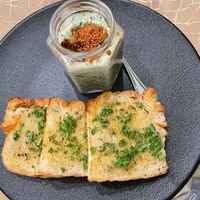 hilli mushroom turmeric cream served with truffle toast,
featuring a delicate balance of flavours. Accompanied by garlic dust, local spinach,
Sarawak white pepper, and dried chil at Manja in Kuala Lumpur