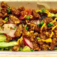 Crispy tempeh with farms greens  at Wandr in Dubai