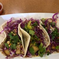 Thai Peanut, Indian Yellow Curry and Panko Crusted “Cod” tacos. Sweet chili & smoked ghost pepper sauce on the side. Excellent!! at Tako Cheena by Pom Pom in Orlando