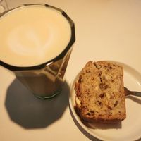 Latte and fluffy banana bread at Apoteka - Coffee & Plants in Tubingen