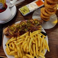 Vegan hotdog and onion rings at The Auld Hoose in Edinburgh