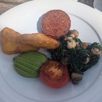Vegan brunch with Avocado, tomato, hash brown, saut̩eed spinach & mushrooms with a quinoa, beet & edamame patty at The Clipper Cafe in Teignmouth