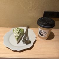 Matcha and white chocolate slice, hot chocolate.   at Naki - vegan sweets in Osaka