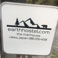 Outdoor sign at Earth Hostel - Nikko Riverhouse in Nikko